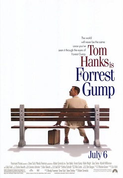 Film poster with a white background and a park bench (facing away from the viewer) near the bottom. A man wearing a white suit is sitting on the right side of the bench and is looking to his left while resting his hands on both sides of him on the bench. A suitcase is sitting on the ground, and the man is wearing tennis shoes. At the top left of the image is the film's tagline and title and at the bottom is the release date and production credits.