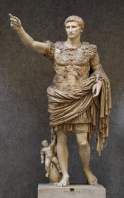 A full-length statue portrait of Augustus. He is depicted wearing armor that shows the story of one of his diplomatic gains as well as with a small cherub and dolphin by his right leg.