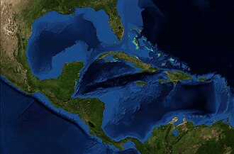 Satellite image of the Caribbean Sea, with Florida located at the top, Central America located on the left, the northern coast of South America at the bottom, and Caribbean islands in the center.